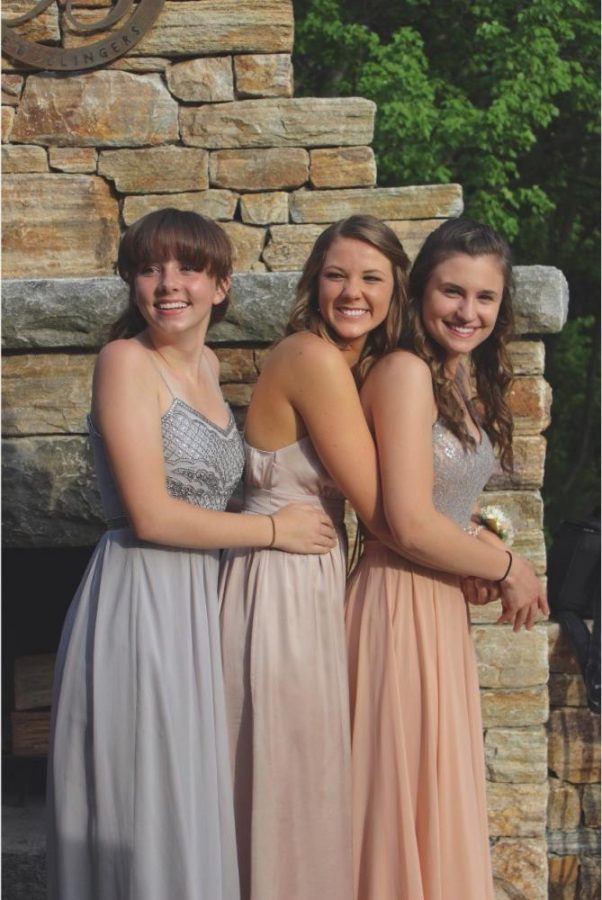 Nicole Burkoski joined by Abby Daily and Jillian Bollinger, pose for pre-prom pictures. 
